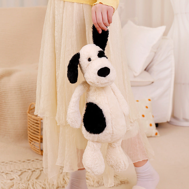 Peluche chien blanc à l'œil noir