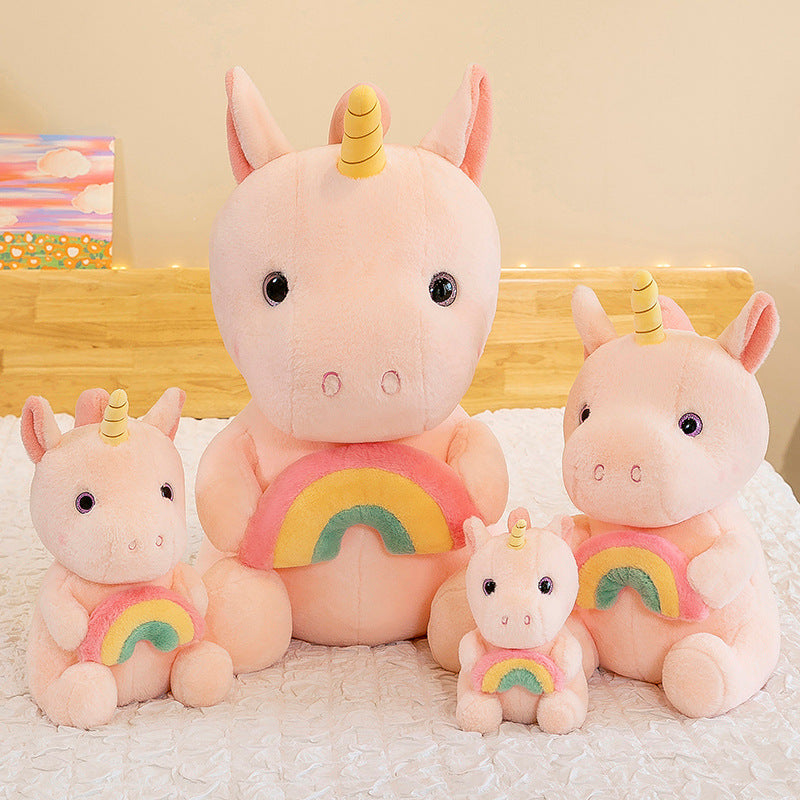 Peluche licorne arc-en-ciel douce avec corne dorée.