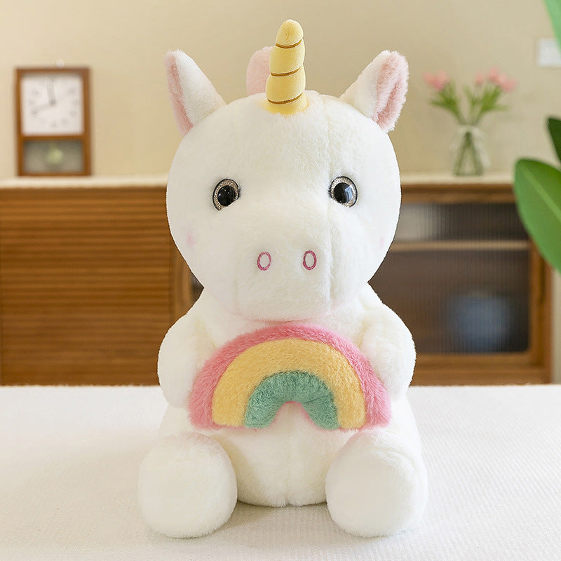 Peluche licorne arc-en-ciel douce avec corne dorée.