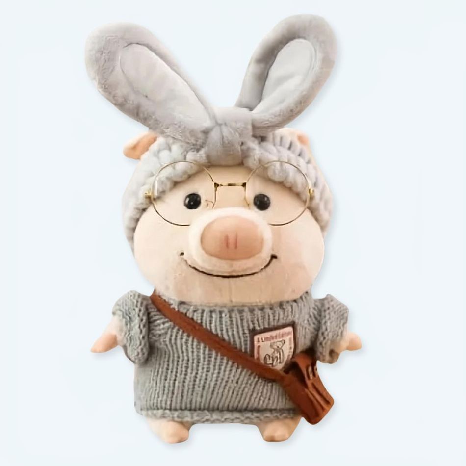 Peluche cochon doux en pull gris hiver chaleureux