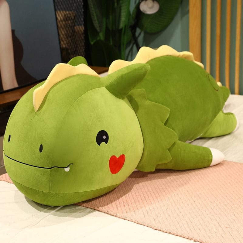 Peluche dinosaure avec logo cœur sur la joue