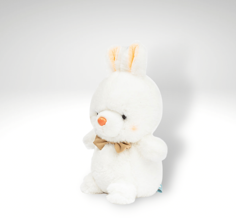 Peluche lapin tout mignon avec un nœud de papillon