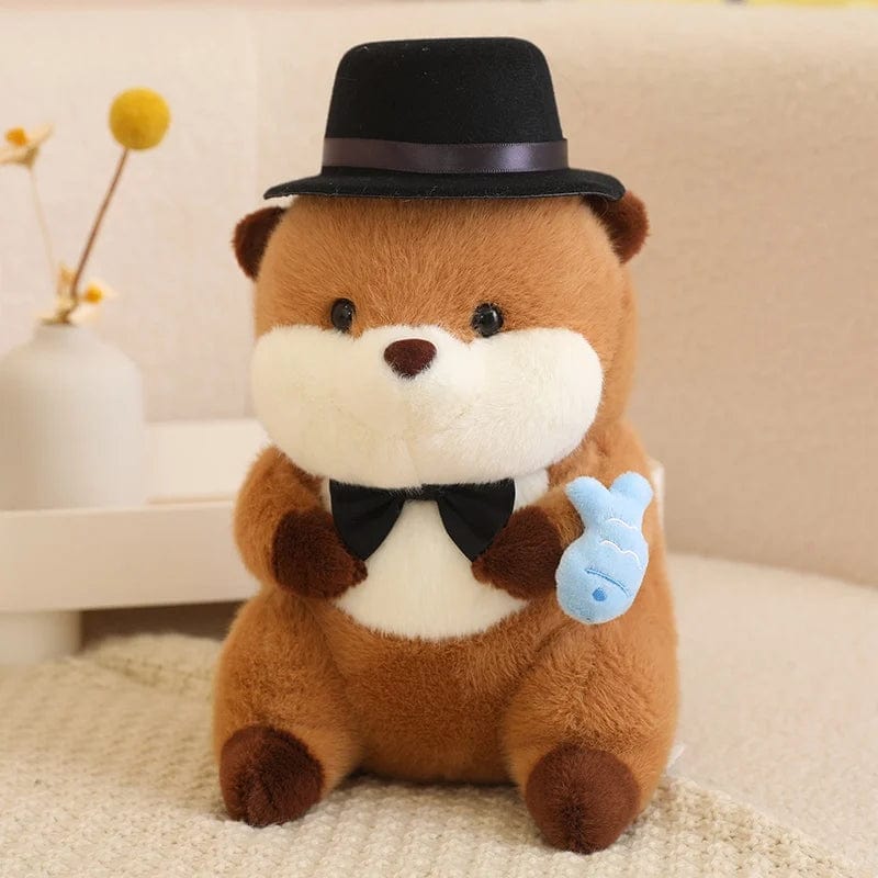 Peluche Loutre avec Chapeau Tenant un Poisson Coloré.