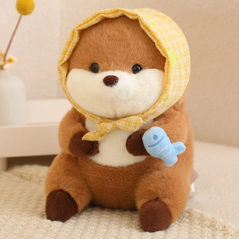 Peluche loutre avec un voile présentant un poisson coloré