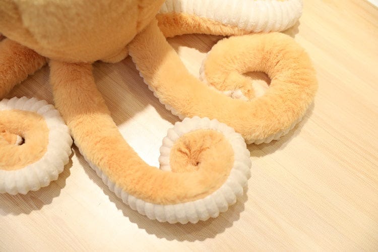 Peluche OctoJoue contente et colorée