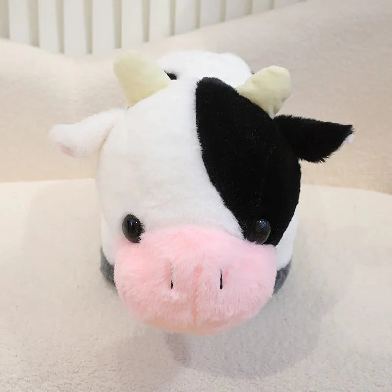 Petite et mignonne peluche vache.