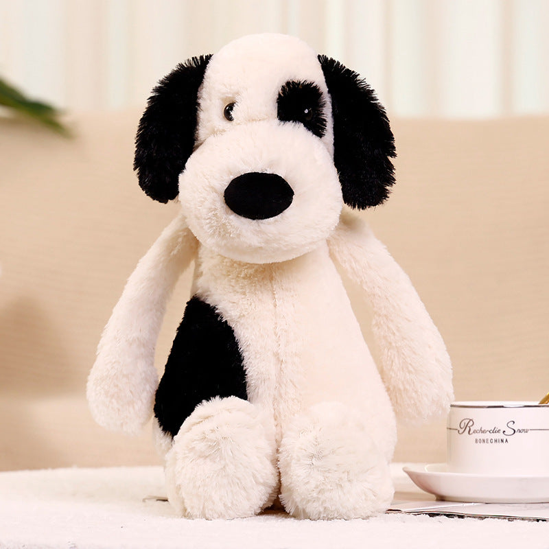 Peluche chien blanc à l'œil noir