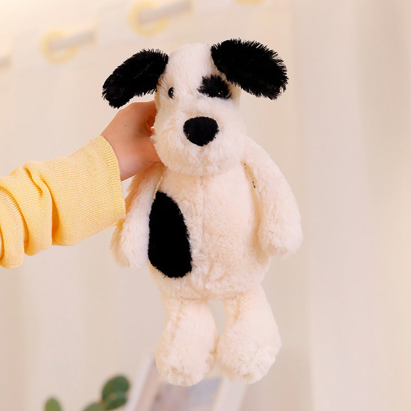 Peluche chien blanc à l'œil noir