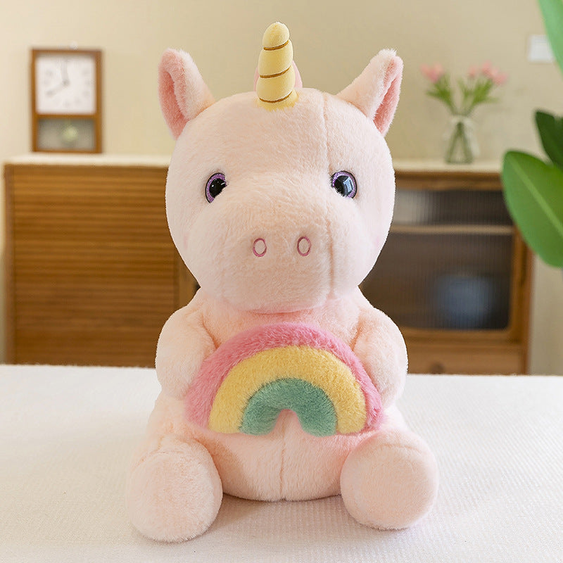 Peluche licorne arc-en-ciel douce avec corne dorée.