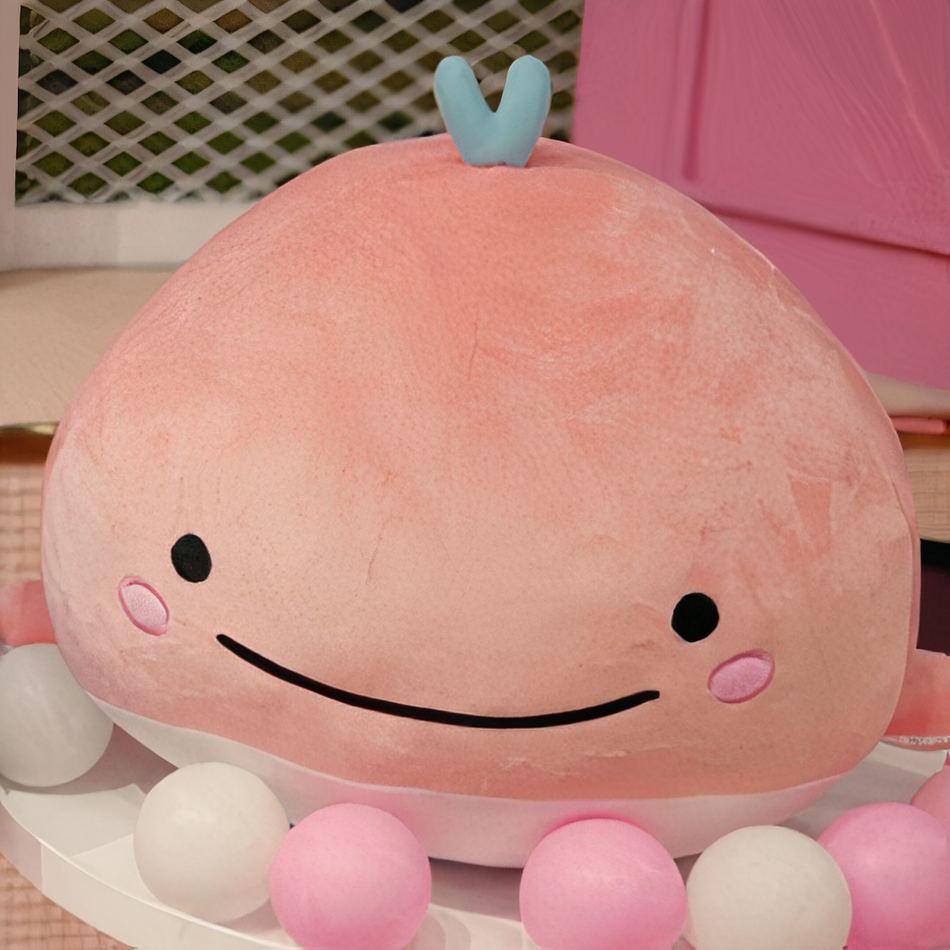 Peluche baleine rose moelleuse pour un câlin océanique.