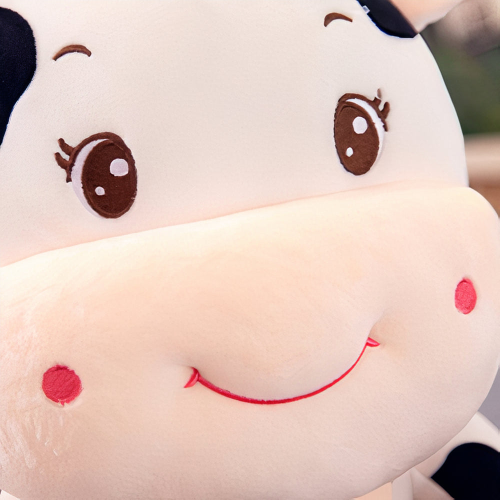 Peluche vache bébé joyeux