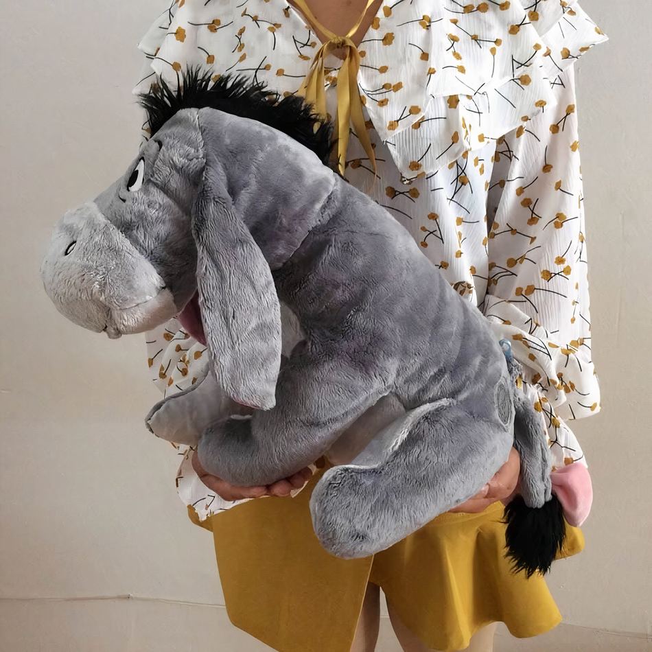 Peluche Bourriquet grand format douce et câline pour enfant
