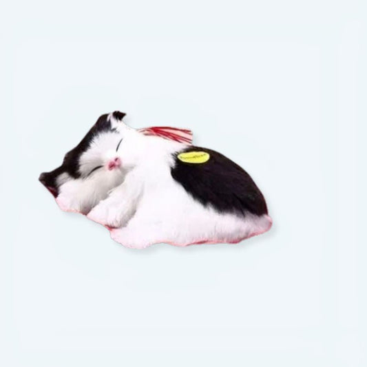 Peluche chat noir et blanc doux pour un sommeil enfant paisible.