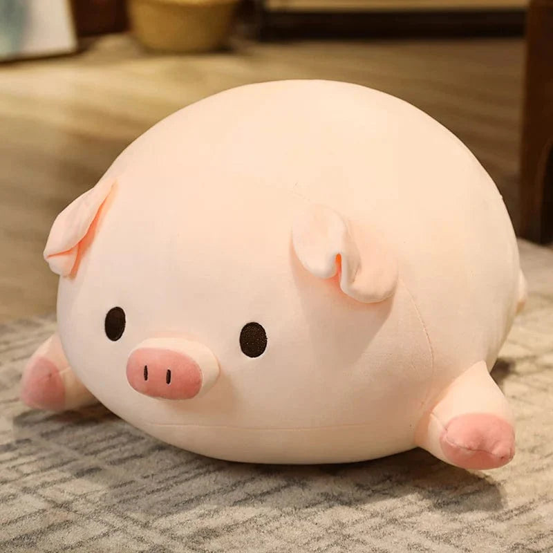 Peluche cochon allongé avec yeux ouverts
