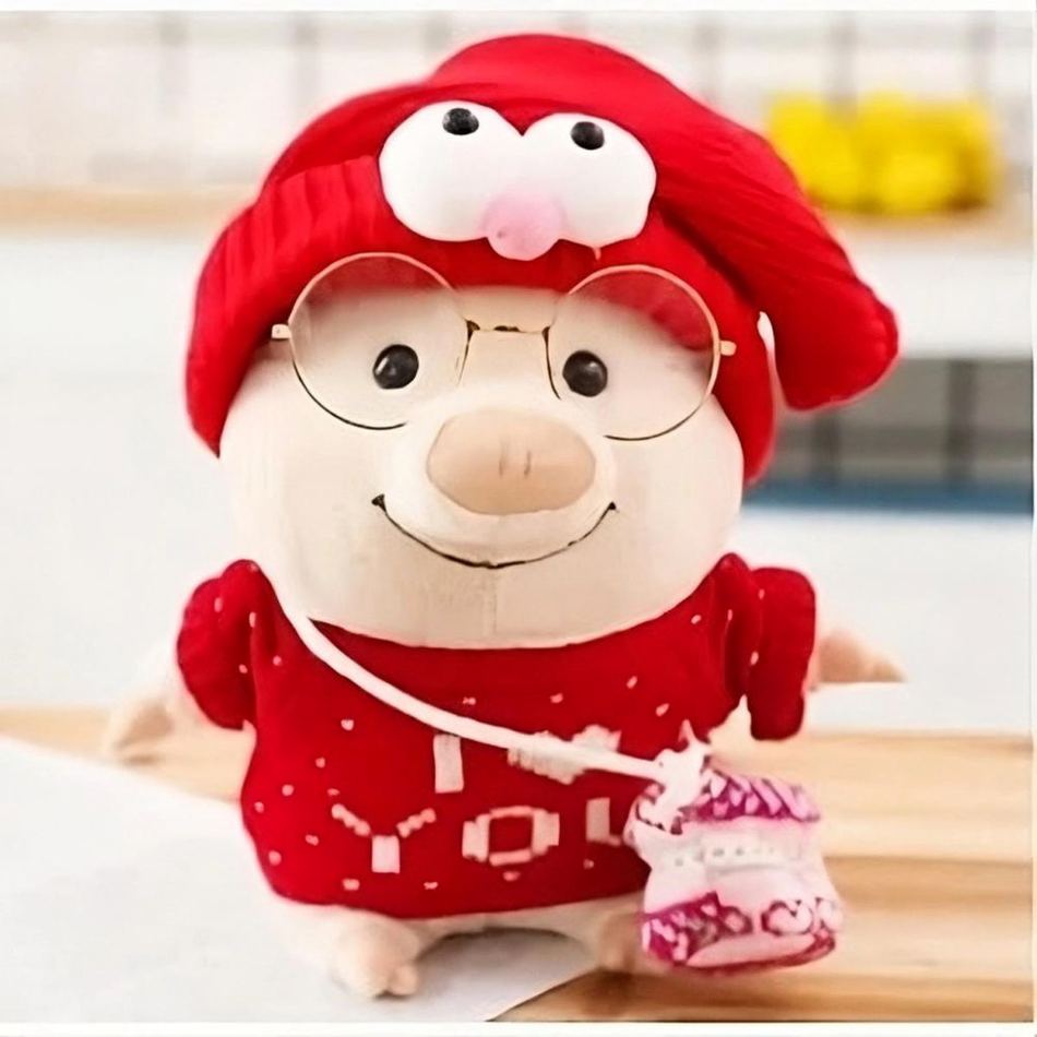 Peluche cochon rose tendre avec un pull doux et un message romantique