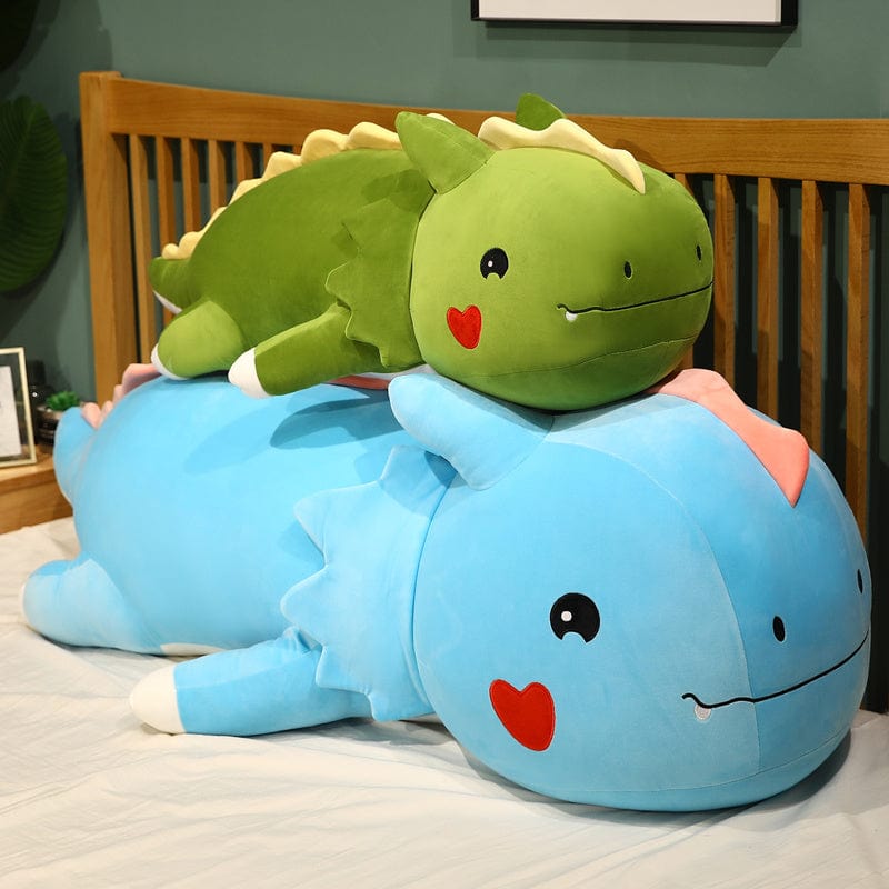 Peluche dinosaure avec logo cœur sur la joue