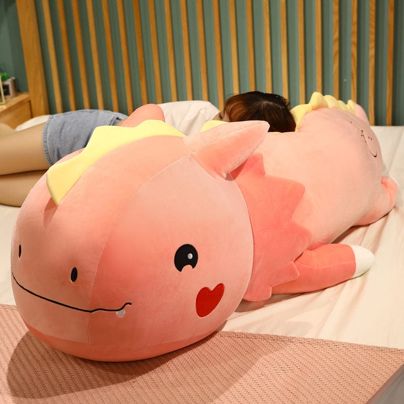 Peluche dinosaure avec logo cœur sur la joue