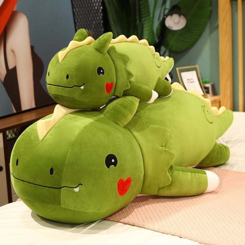 Peluche dinosaure avec logo cœur sur la joue