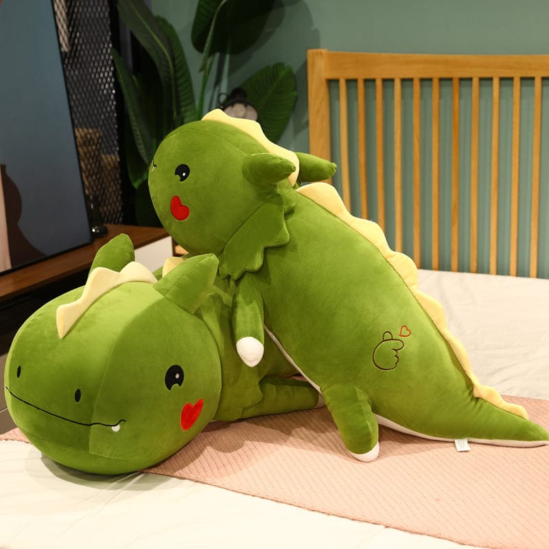 Peluche dinosaure avec logo cœur sur la joue