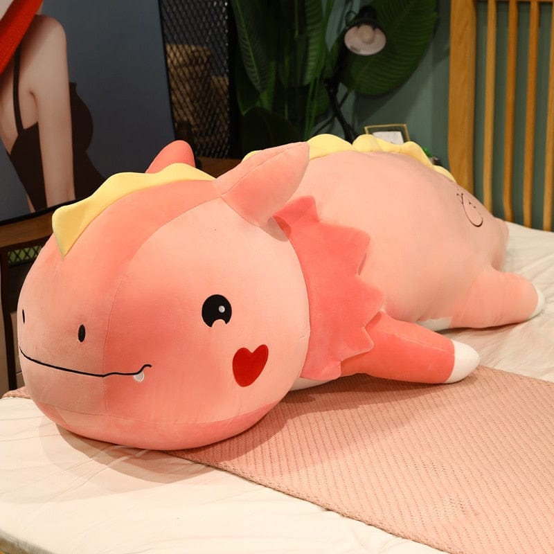 Peluche dinosaure avec logo cœur sur la joue