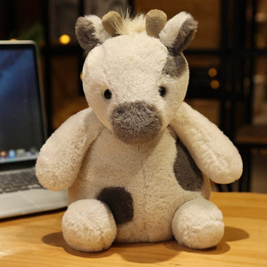 Peluche girafe bébé blanche aux tâches grises