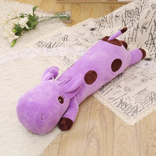 Peluche girafe géante allongée mauve