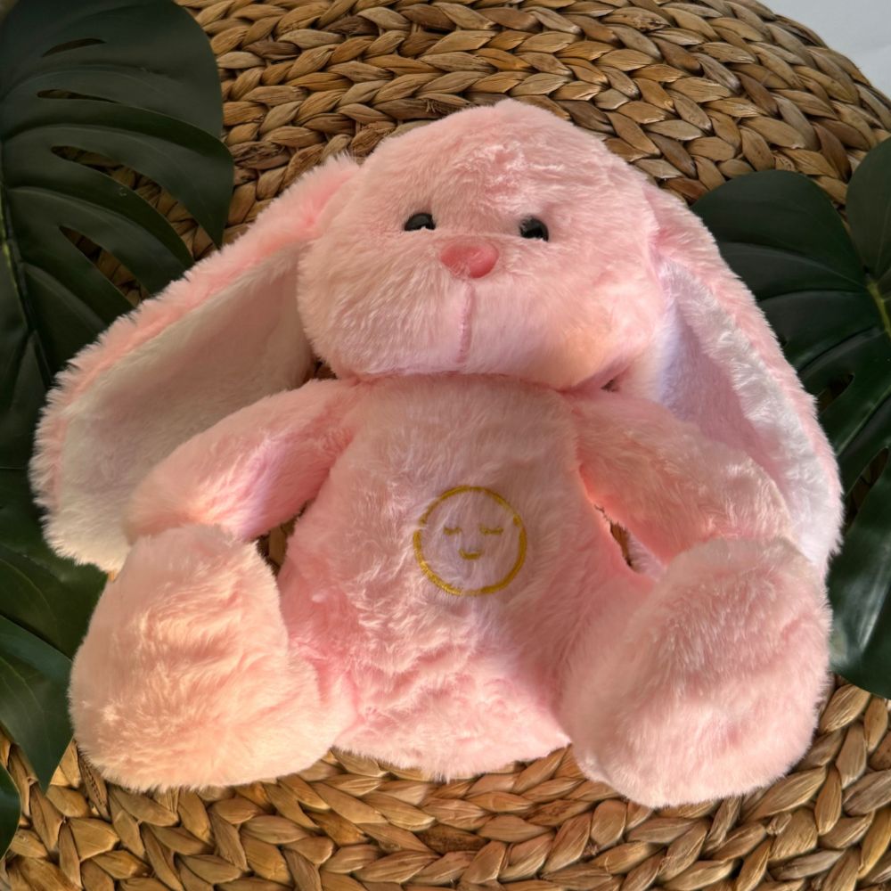 Peluche lapin rose : veilleuse douce pour sommeil d'enfant.