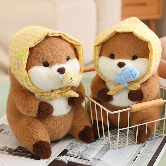 Peluche loutre avec un voile présentant un poisson coloré