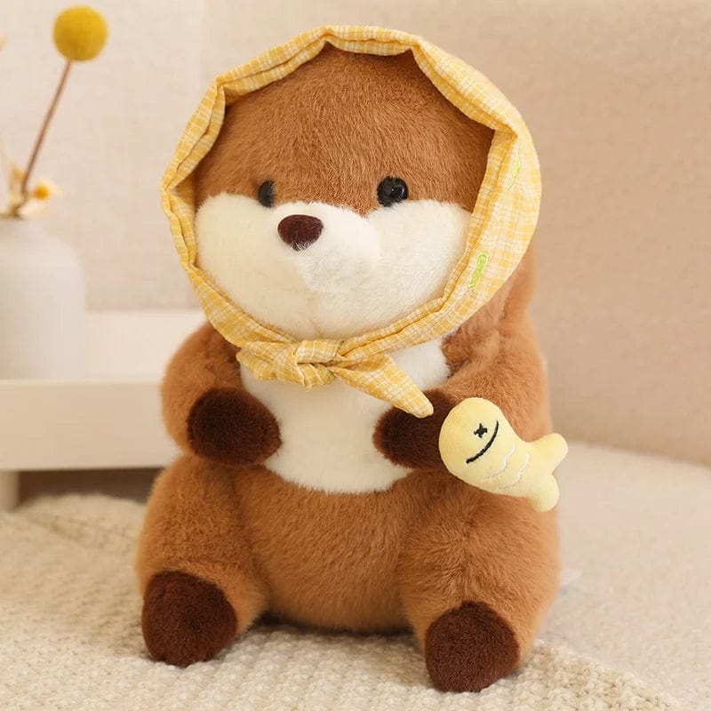 Peluche loutre avec un voile présentant un poisson coloré