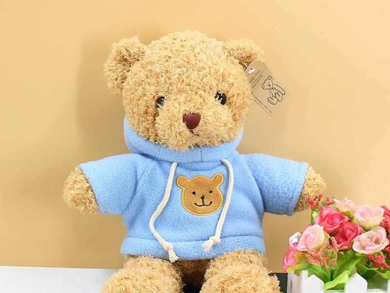 Peluche ourson doux avec pull bleu câlin pour l'hiver des enfants