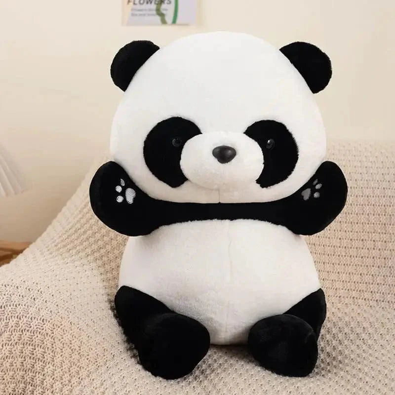 Peluche panda souriant et assis