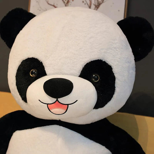Peluche panda géant  avec fleur