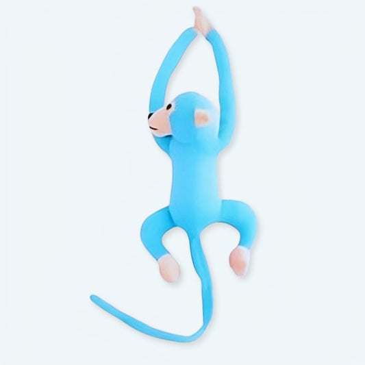 Peluche singe kawaii avec longue queue bleue câline.