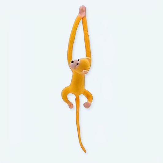 Peluche singe kawaii jaune avec une longue queue moelleuse pour enfant.