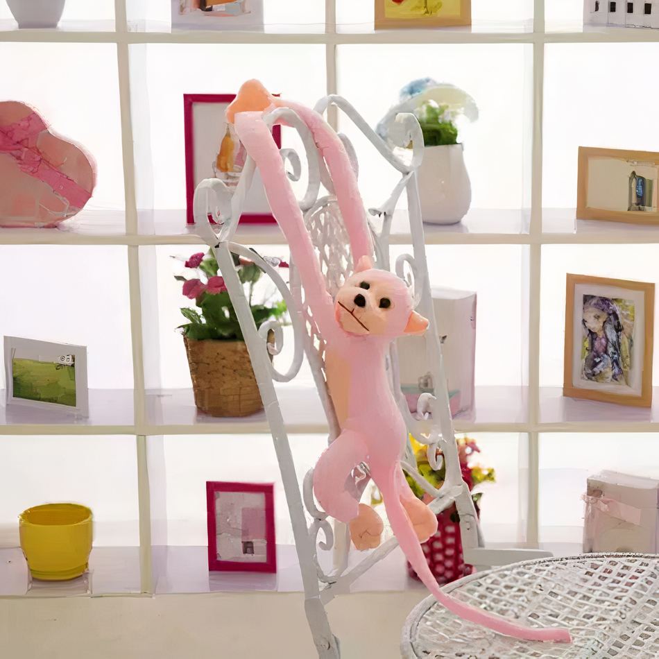 Peluche singe kawaii rose tendre avec longue queue douce