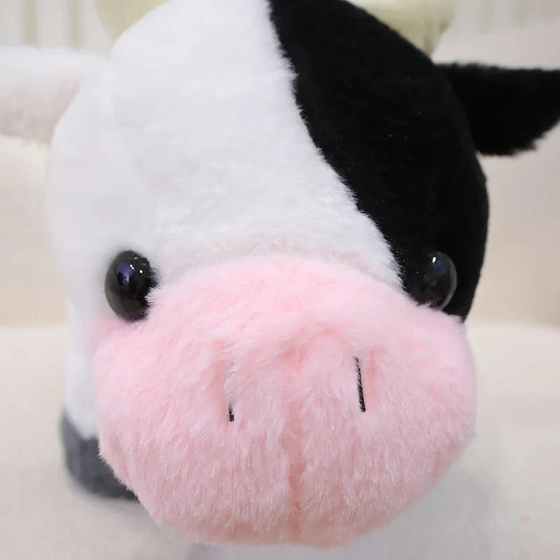Petite et mignonne peluche vache.