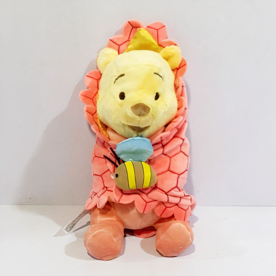 Peluche Winnie l'Ourson : la couverture douce réconfortante pour enfant